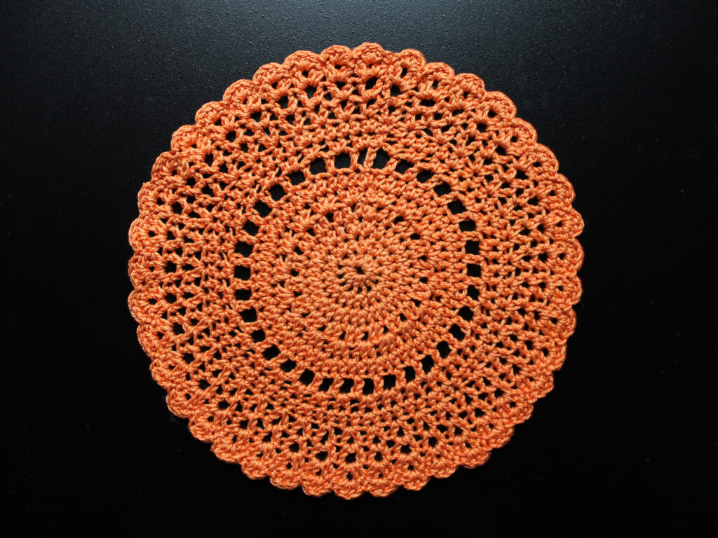 crocheted doily made with orange cotton for autumn halloween decor 1024x768